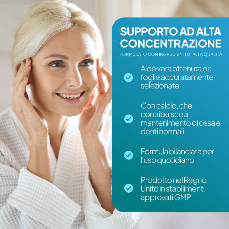 Una donna bionda sorridente, vestita con una tunica bianca, si tiene le tempie accanto a un grande pannello informativo color verde acqua con un testo in italiano sugli ingredienti di supporto ad alta concentrazione, tra cui l’aloe vera e il calcio.